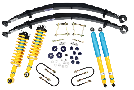 An assortment of vehicle suspension parts including shocks, springs, and mounting hardware.
