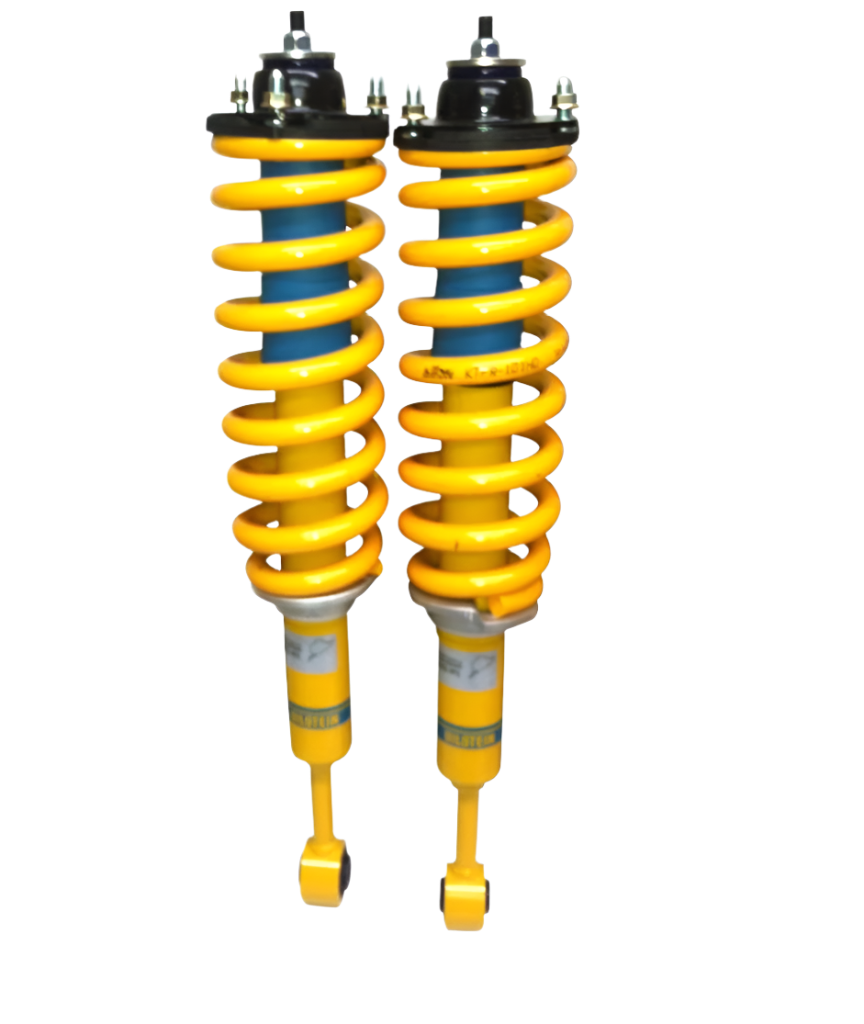 A pair of yellow and black Bilstein front struts for a Ford Ranger vehicle.