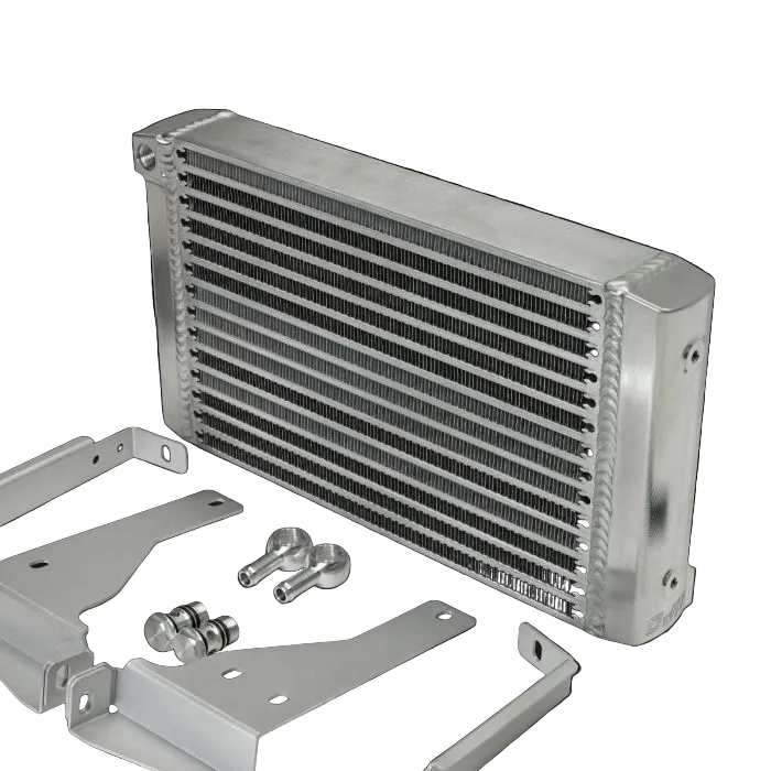 Car radiator with mounting brackets and screws on a black background